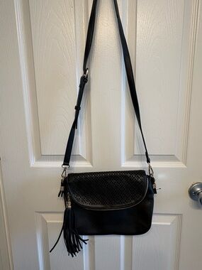 Madison West Black Laser-Cut Hobo Crossbody with Tassel